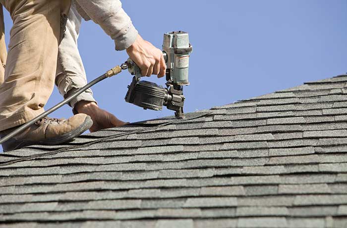 man installing Roof